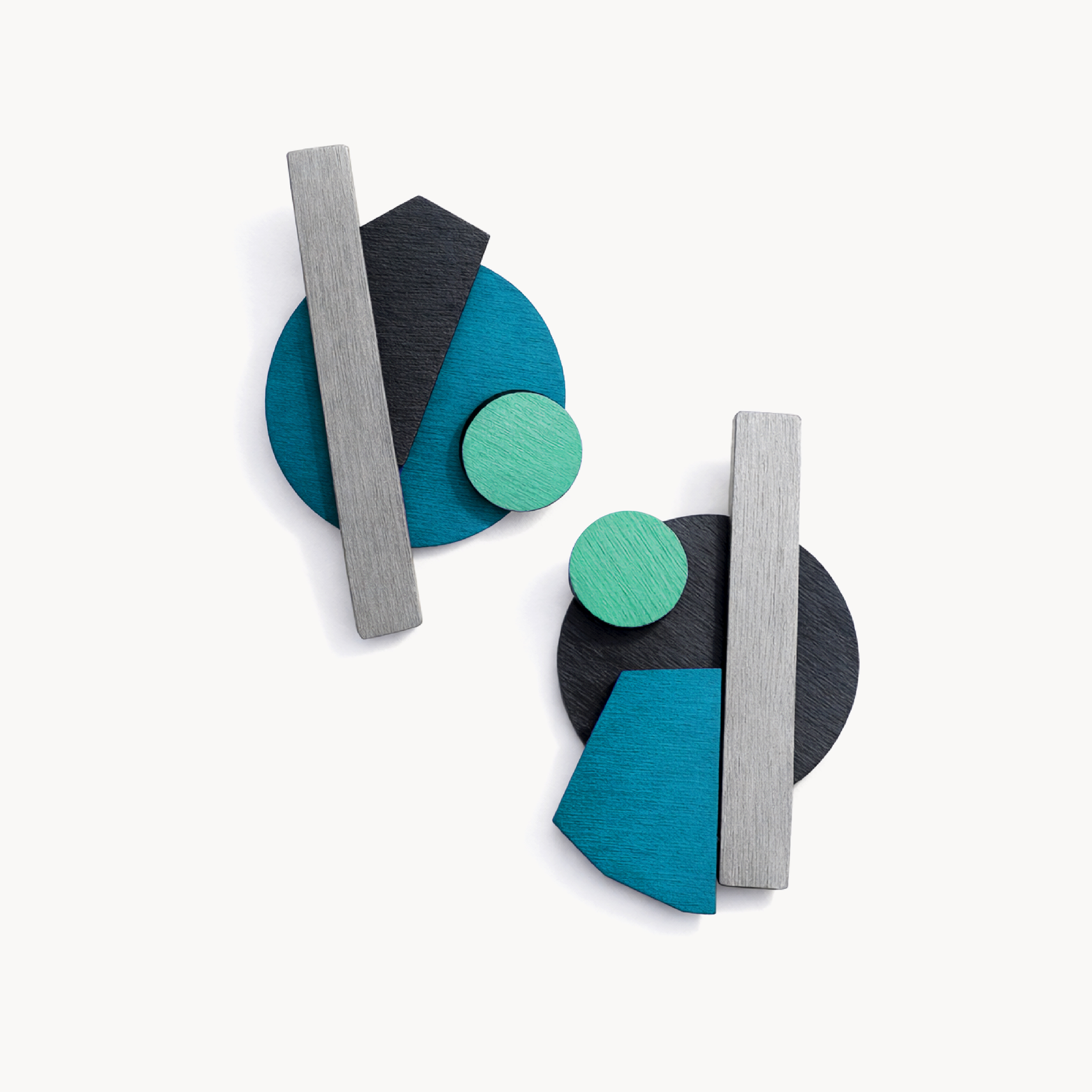 Eye-catching geometric earrings with a fresh teal and mint palette